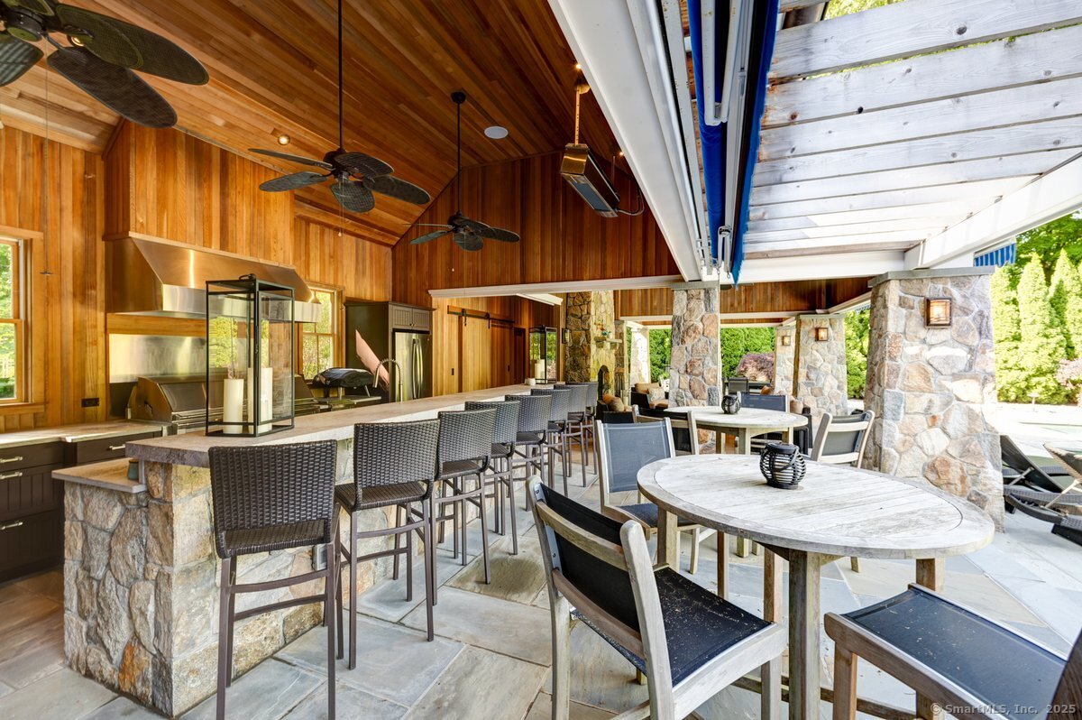174 Branchville Road Ridgefield, CT 06877 - Photo 33 of 40 a view of an outside dining space with furniture