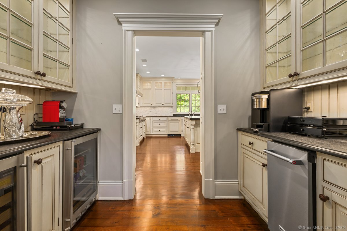 174 Branchville Road Ridgefield, CT 06877 - Photo 6 of 40 a kitchen with a sink and wooden floor