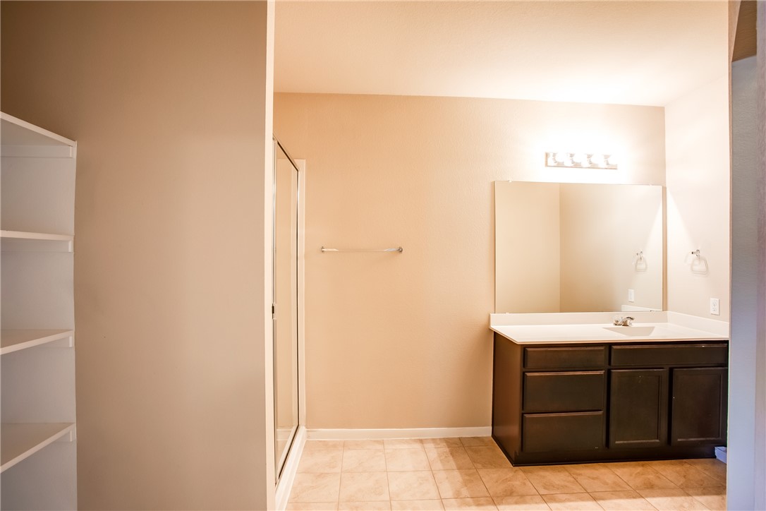 607 Brashear Lane Cedar Park, TX 78613 - Photo 19 of 28 a bathroom with a sink and a mirror