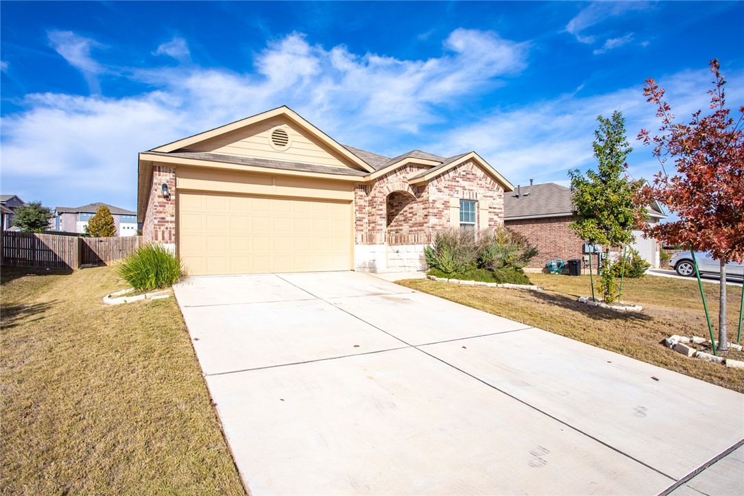 607 Brashear Lane Cedar Park, TX 78613 - Photo 2 of 28 a front view of a house with a yard and garage