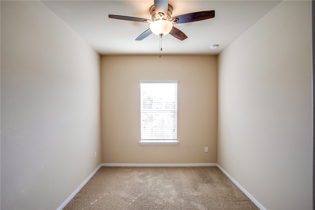607 Brashear Lane Cedar Park, TX 78613 - Photo 21 of 28 an empty room with windows and fan