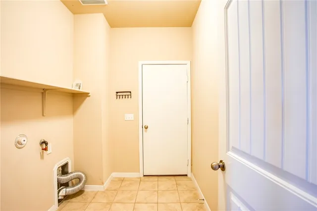 a view of a house with a yard and wooden fence
