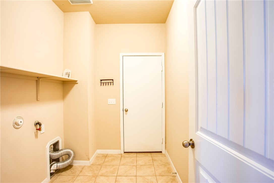 607 Brashear Lane Cedar Park, TX 78613 - Photo 24 of 28 a bathroom with a granite countertop sink and a mirror