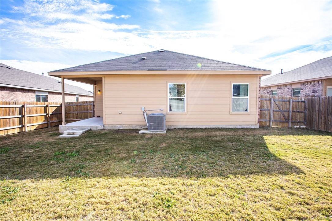 607 Brashear Lane Cedar Park, TX 78613 - Photo 25 of 28 a view of a house with a yard and wooden fence