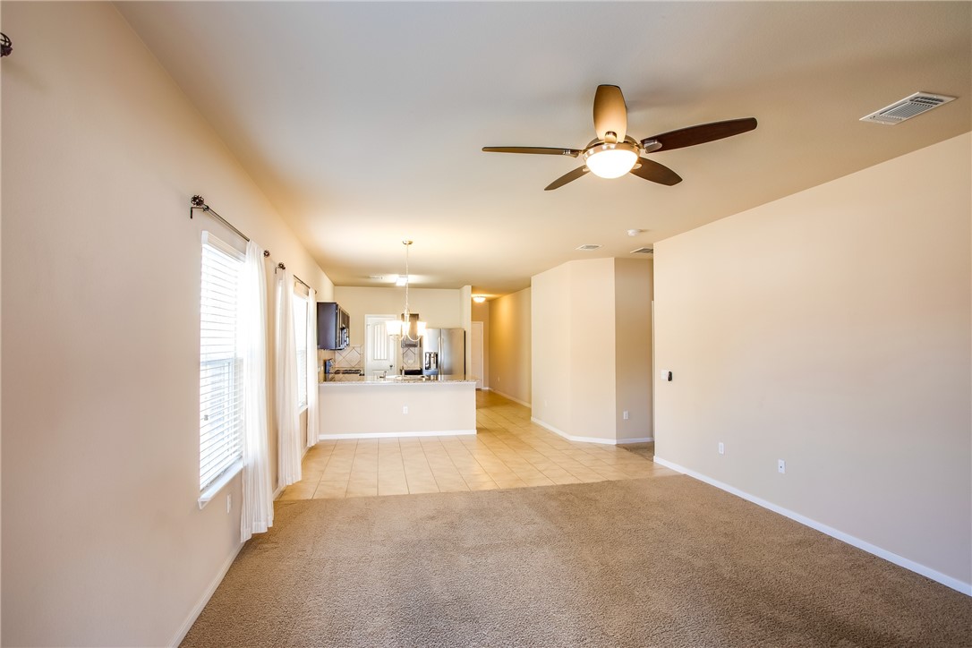 607 Brashear Lane Cedar Park, TX 78613 - Photo 9 of 28 a view of a hallway with a ceiling fan and window