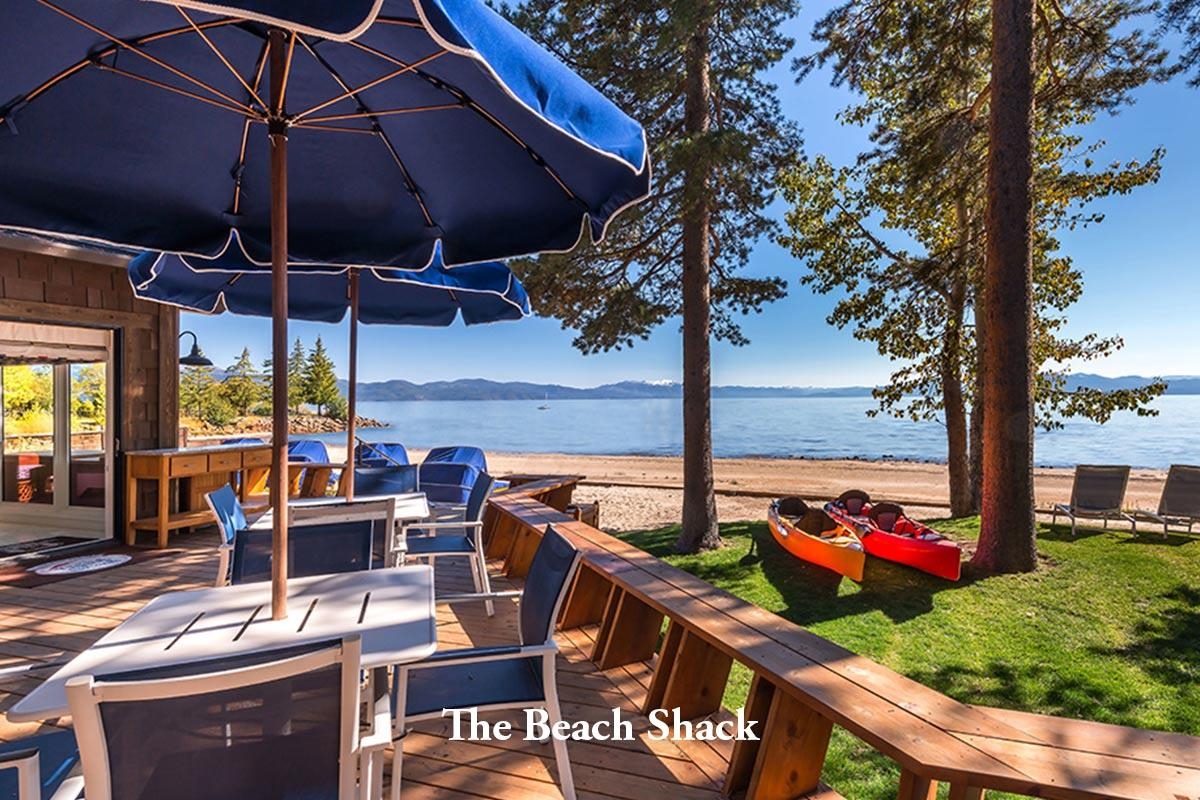 8143 Fallen Leaf Way Truckee, CA 96161 - Photo 9 of 17 a view of a patio with a table and chairs under an umbrella