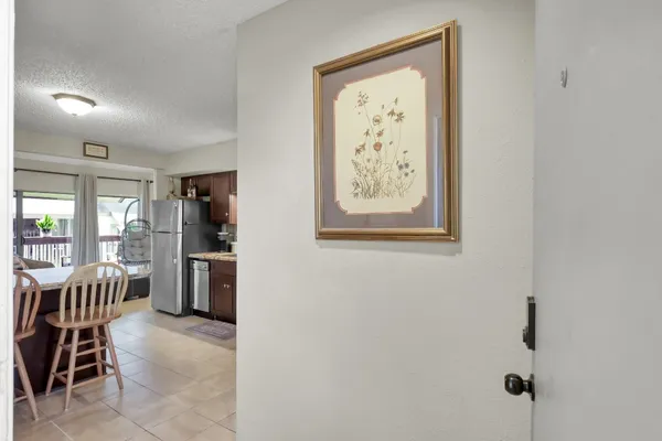 a kitchen with stainless steel appliances granite countertop a stove a sink dishwasher and a refrigerator