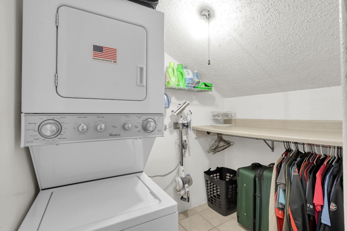 12900 Walden Road, Unit 620 Montgomery, TX 77356 - Photo 15 of 21 a utility room with lots of different colored cloths