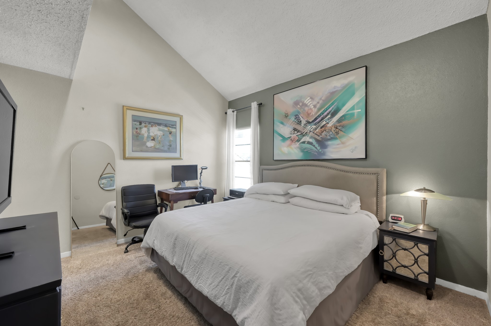 12900 Walden Road, Unit 620 Montgomery, TX 77356 - Photo 9 of 21 a bedroom with bed a lamp and a chandelier