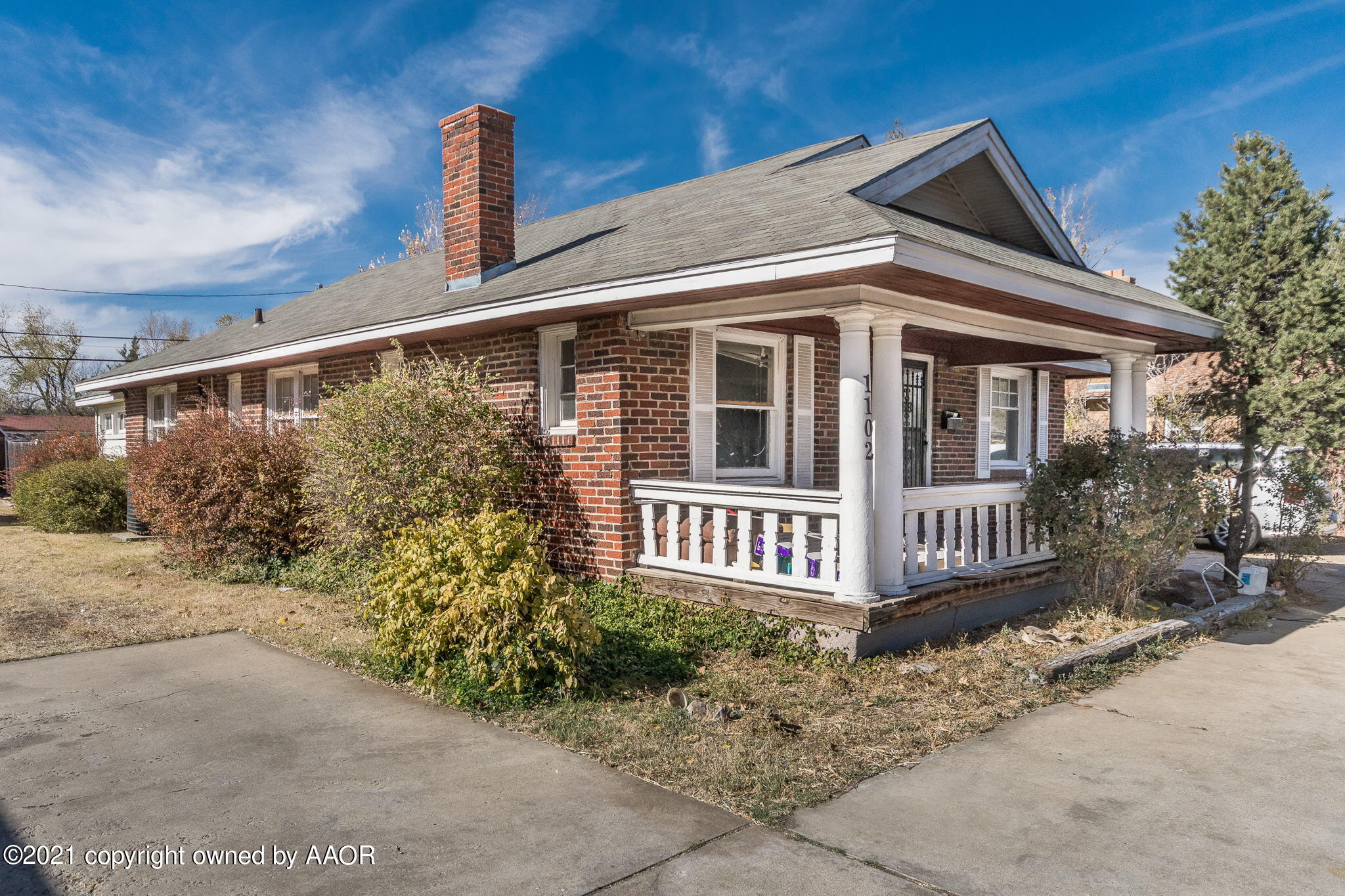 1102 South Western Street Amarillo, TX 79106 - Photo 1 of 11 a front view of a house with garden