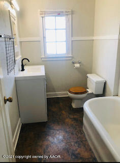 1102 South Western Street Amarillo, TX 79106 - Photo 5 of 11 a bathroom with a toilet and a sink