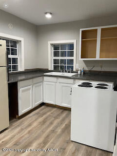 1102 South Western Street Amarillo, TX 79106 - Photo 9 of 11 a kitchen with stainless steel appliances granite countertop a stove a sink and a microwave