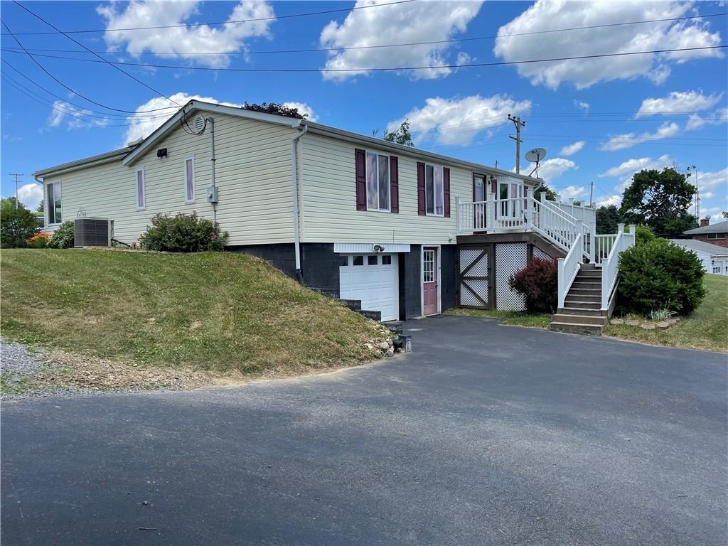 118 Burtner Road Butler, PA 16002 - Photo 2 of 22 a view of a house with a yard and garage