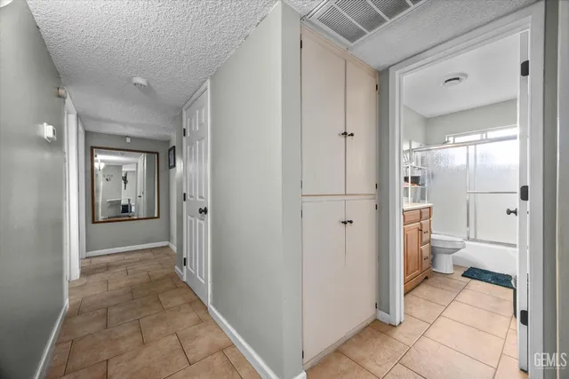 view of a bathroom with a glass door shower