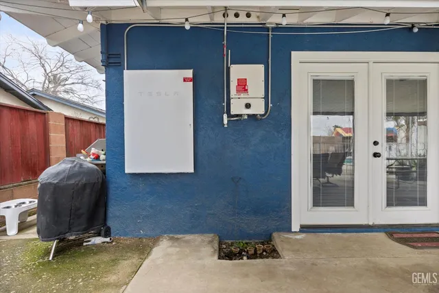 a living room with a baby crib furniture and a window