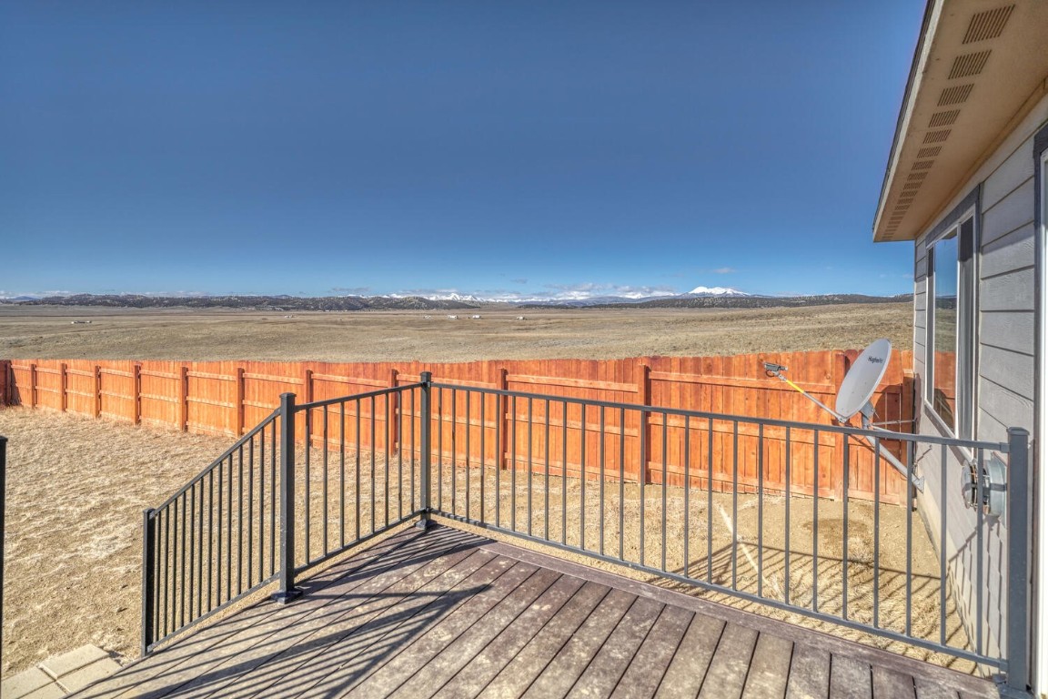 608 Rio Blanco Road Hartsel, CO 80449 - Photo 14 of 26 a view of a balcony with wooden floor
