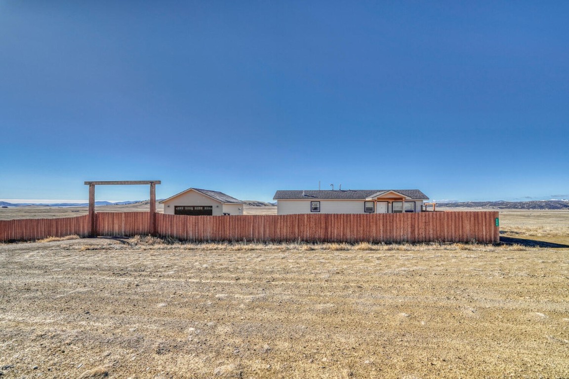 608 Rio Blanco Road Hartsel, CO 80449 - Photo 16 of 26 a view of a large pool with a house in the background
