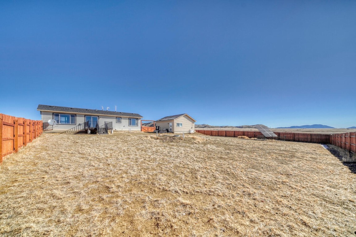 608 Rio Blanco Road Hartsel, CO 80449 - Photo 20 of 26 a bedroom with a bed and a night stand
