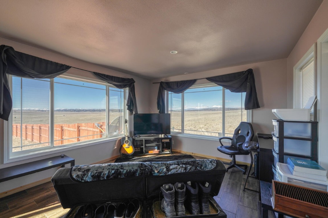 608 Rio Blanco Road Hartsel, CO 80449 - Photo 3 of 26 a view of a workspace with furniture and window