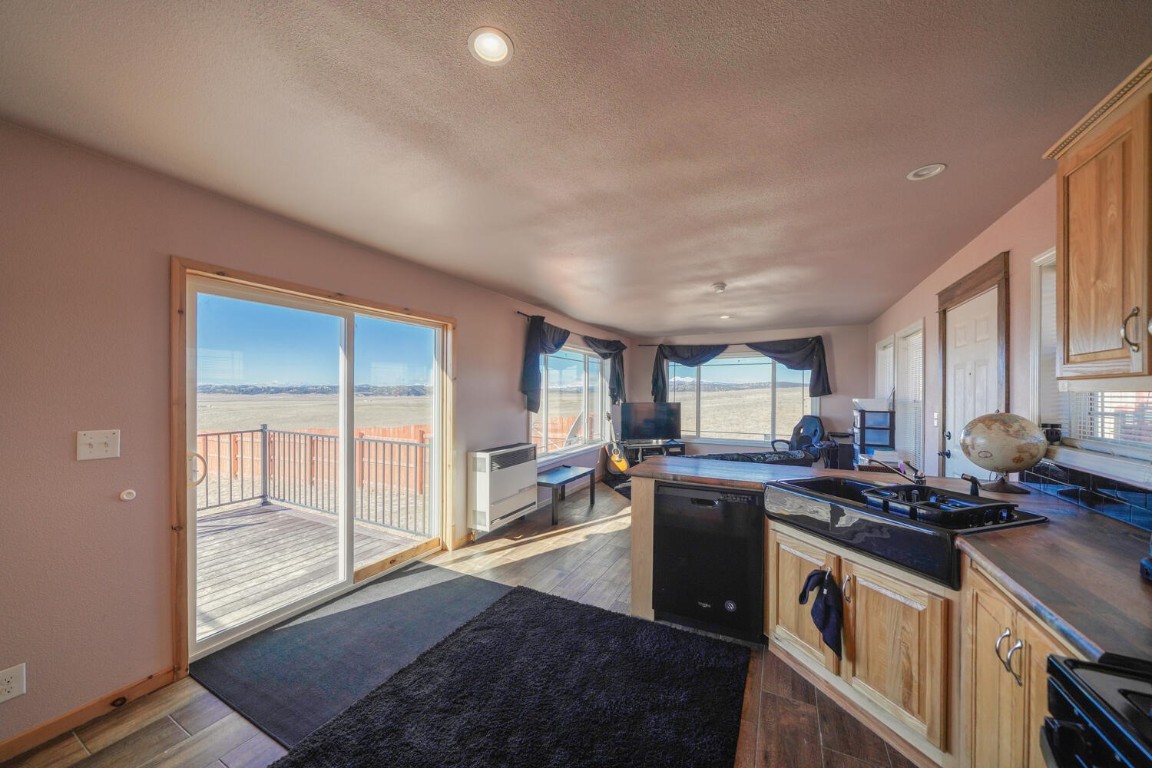 608 Rio Blanco Road Hartsel, CO 80449 - Photo 8 of 26 a kitchen with stainless steel appliances granite countertop a stove a sink and a refrigerator