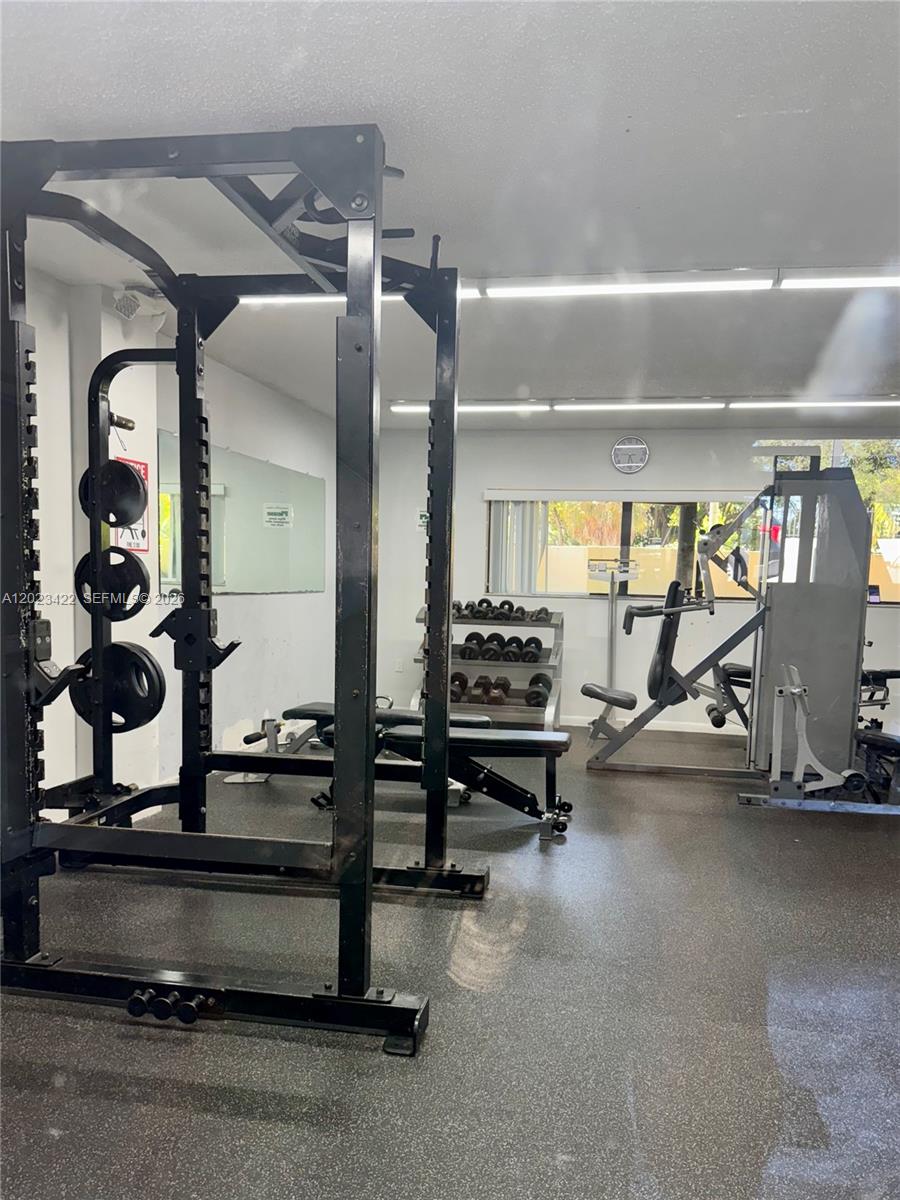 605 Ives Dairy Road, Unit 3067 Miami, FL 33179 - Photo 24 of 28 a view of a room with gym equipment