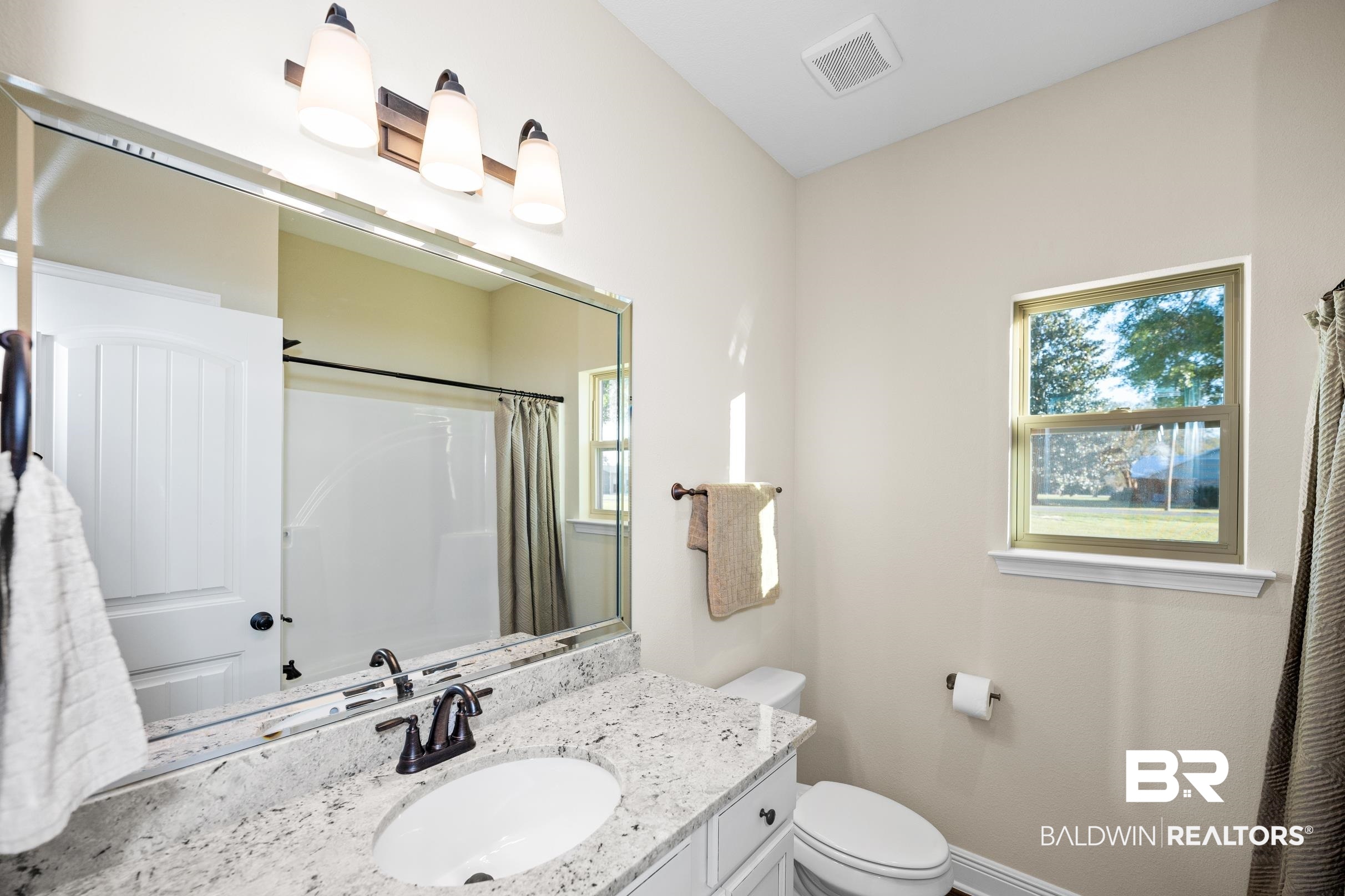 12833 Ward Road West Stapleton, AL 36578 - Photo 17 of 27 Bathroom featuring a shower with shower curtain and vanity