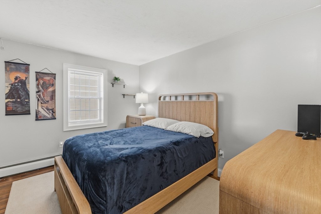 58 Bowler Street Fall River, MA 02723 - Photo 16 of 32 a bedroom with a bed and painting on the wall