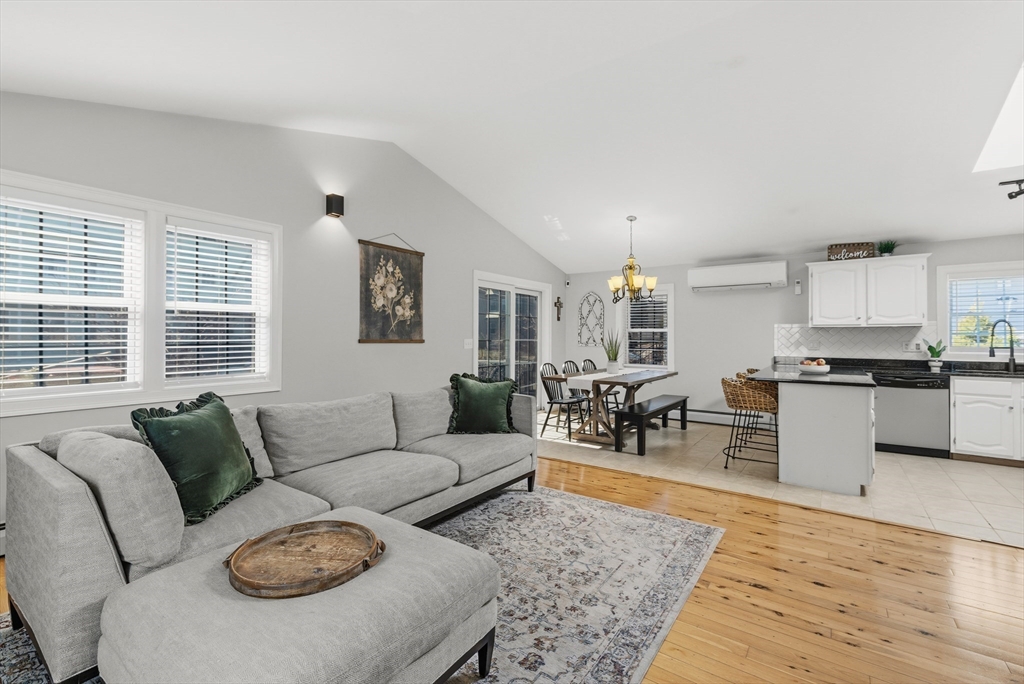 58 Bowler Street Fall River, MA 02723 - Photo 2 of 32 a living room with furniture wooden floor and a large window