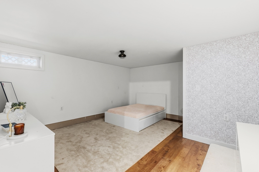 58 Bowler Street Fall River, MA 02723 - Photo 23 of 32 a bedroom with a bed and a night stand
