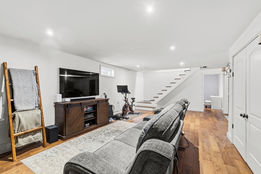 58 Bowler Street Fall River, MA 02723 - Photo 24 of 32 a living room with furniture and a flat screen tv