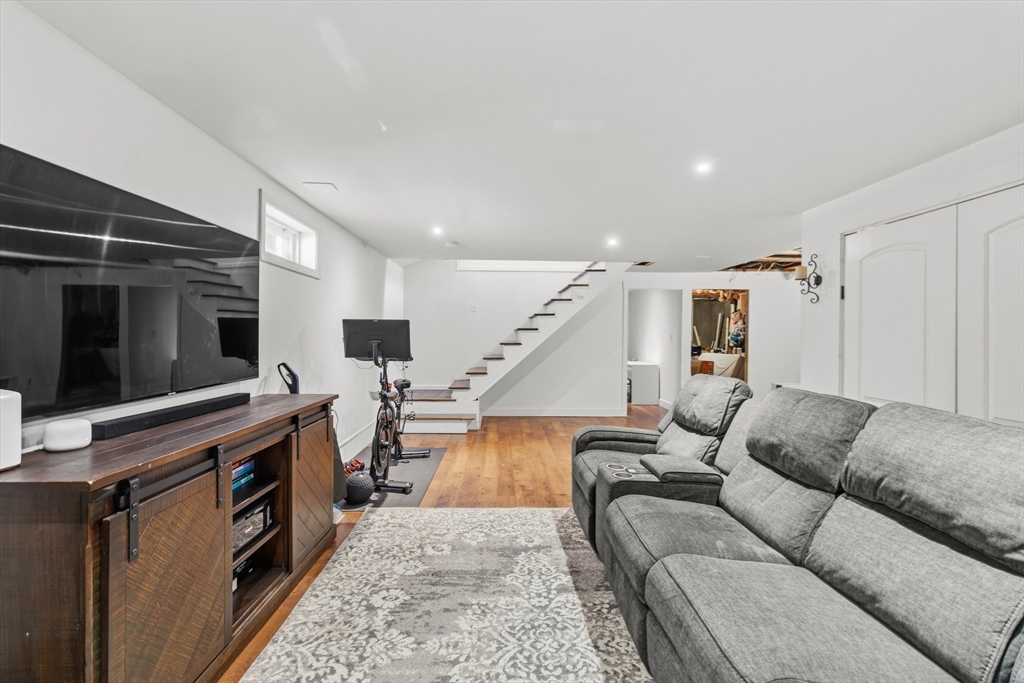 58 Bowler Street Fall River, MA 02723 - Photo 25 of 32 a living room with furniture and a flat screen tv