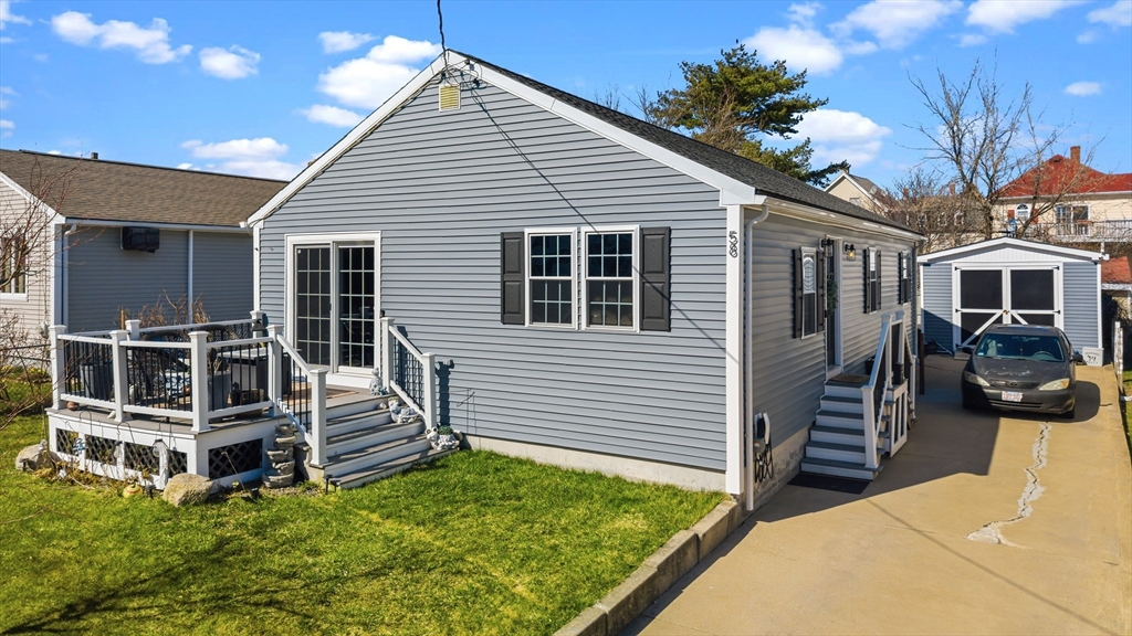 58 Bowler Street Fall River, MA 02723 - Photo 27 of 32 a view of a house with backyard and couches