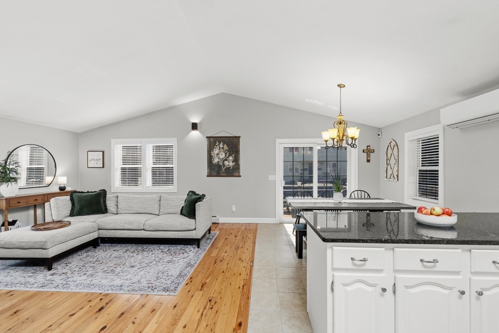 58 Bowler Street Fall River, MA 02723 - Photo 6 of 32 a living room with furniture and a chandelier