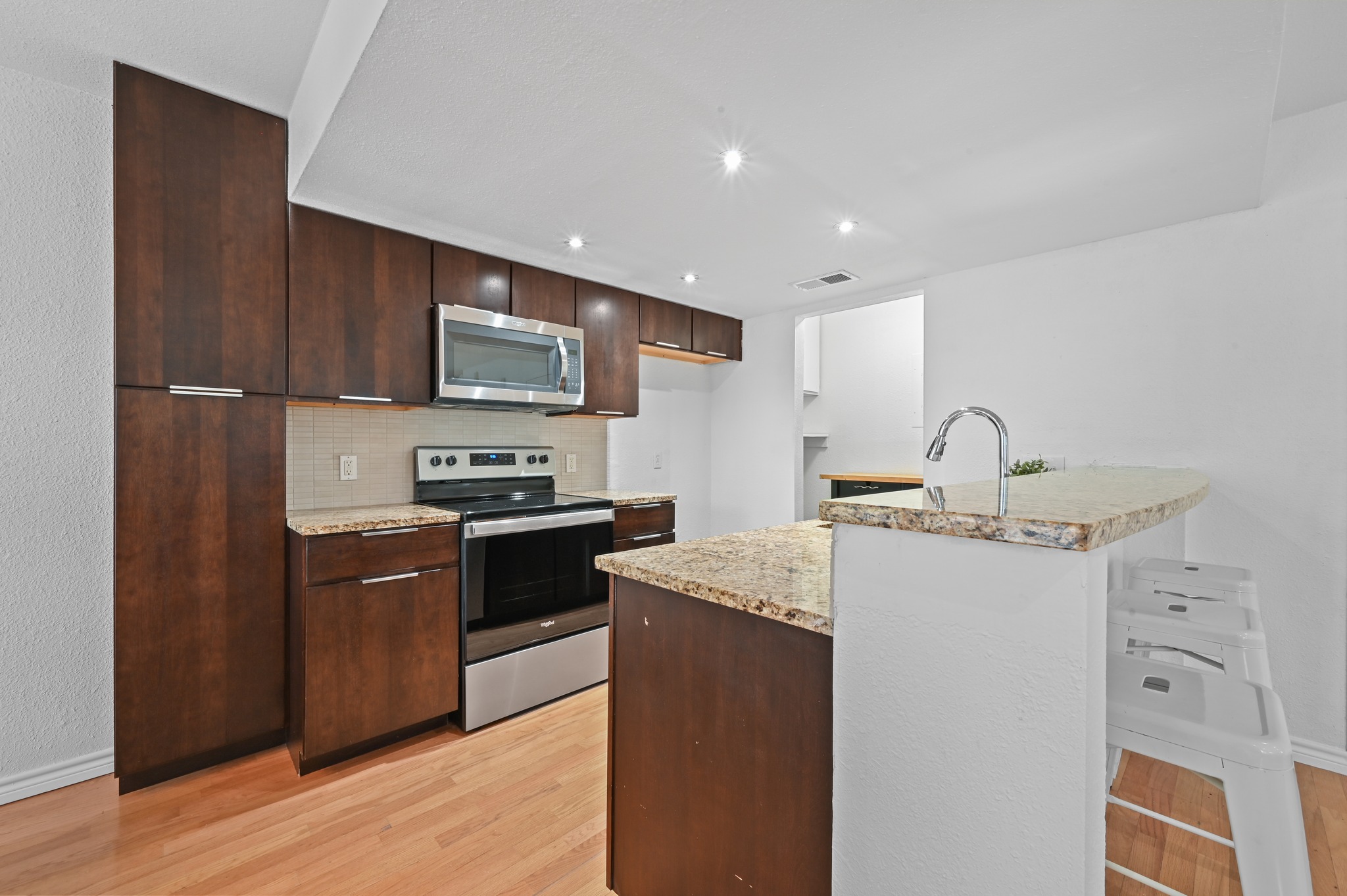 1504 Allen Road, Unit B Austin, TX 78746 - Photo 8 of 22 Kitchen with breakfast bar