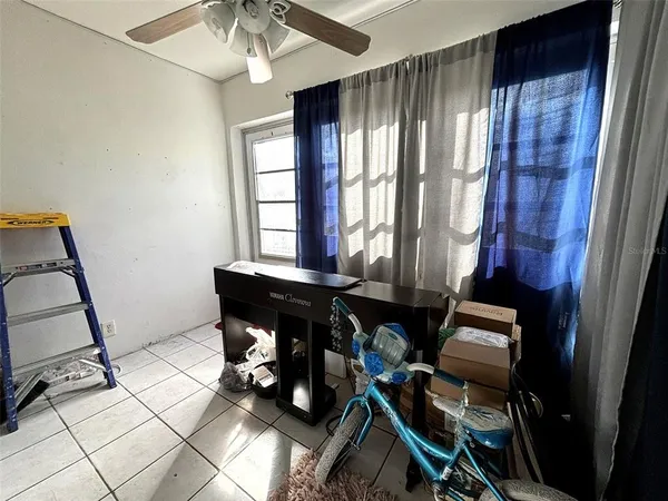 a view of entryway with workspace and window