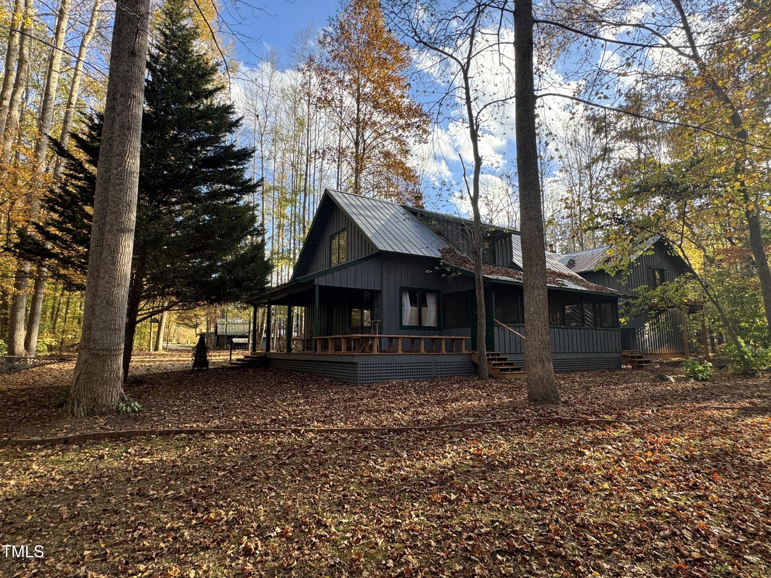 82 Woodspryte Hollow Road Timberlake, NC 27583 - Photo 11 of 29 a view of a house with a yard