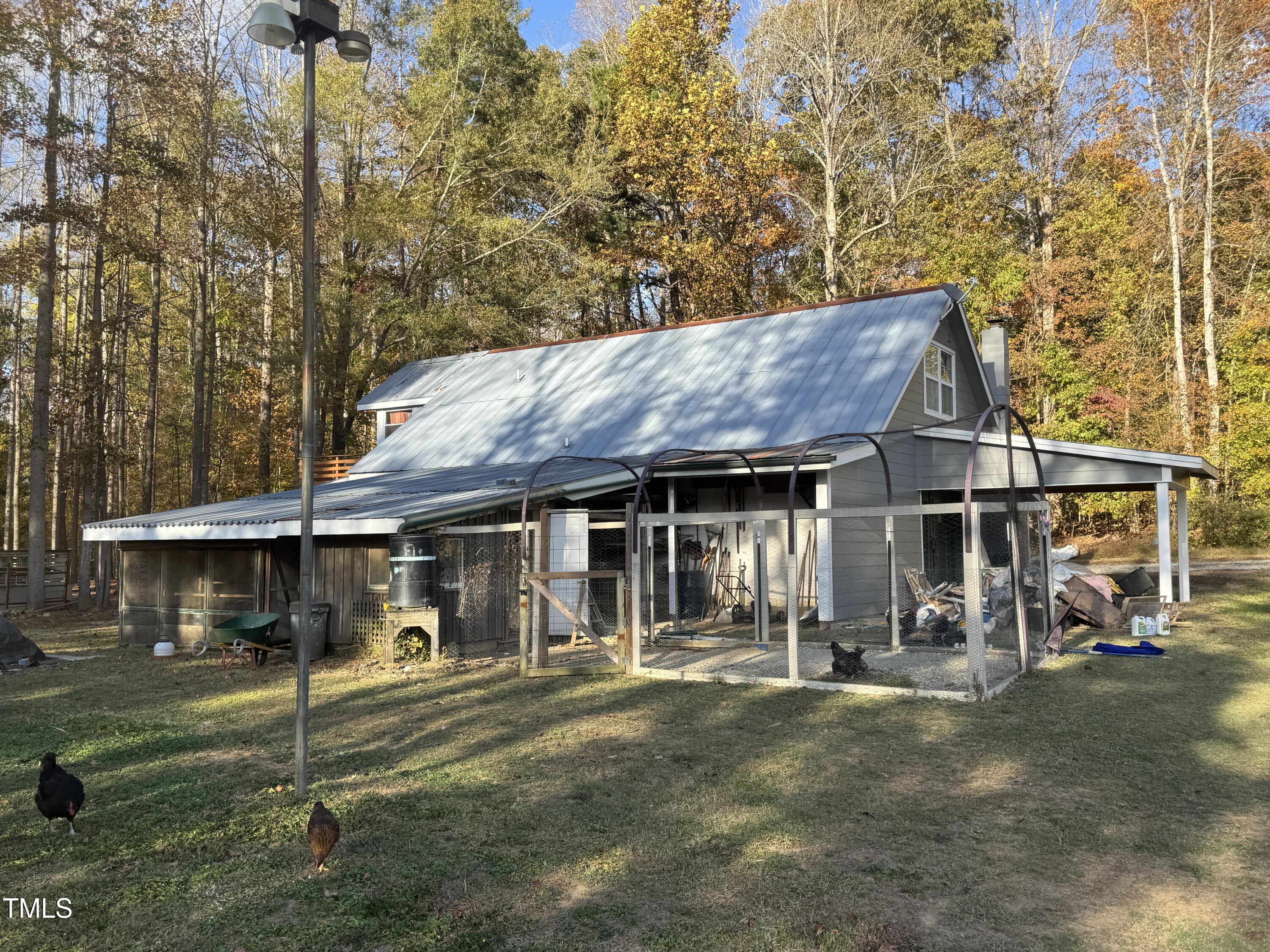 82 Woodspryte Hollow Road Timberlake, NC 27583 - Photo 13 of 29 a view of a house with backyard
