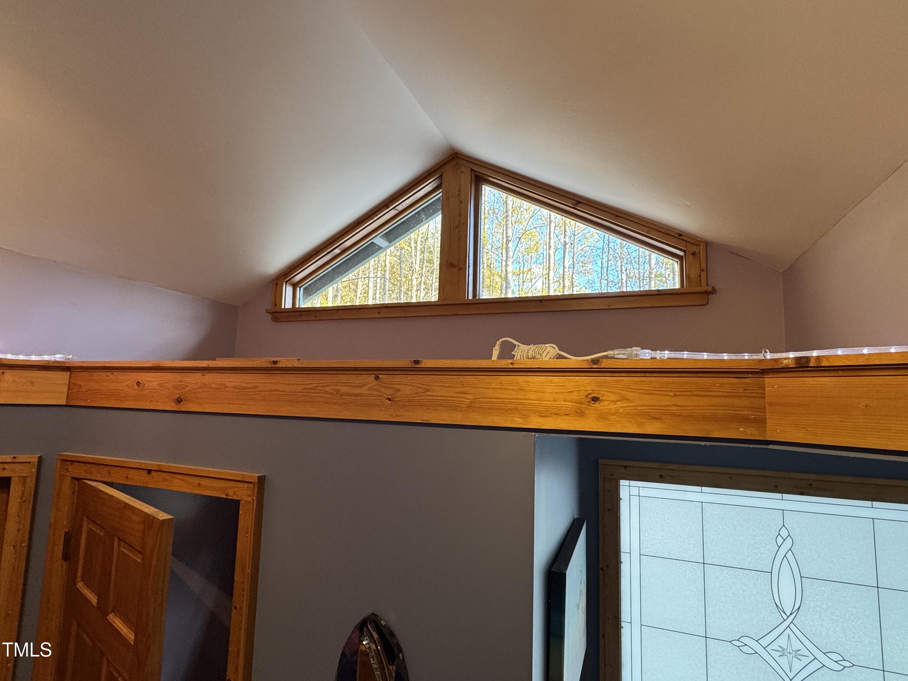 82 Woodspryte Hollow Road Timberlake, NC 27583 - Photo 20 of 29 a view of an empty room and wooden floor