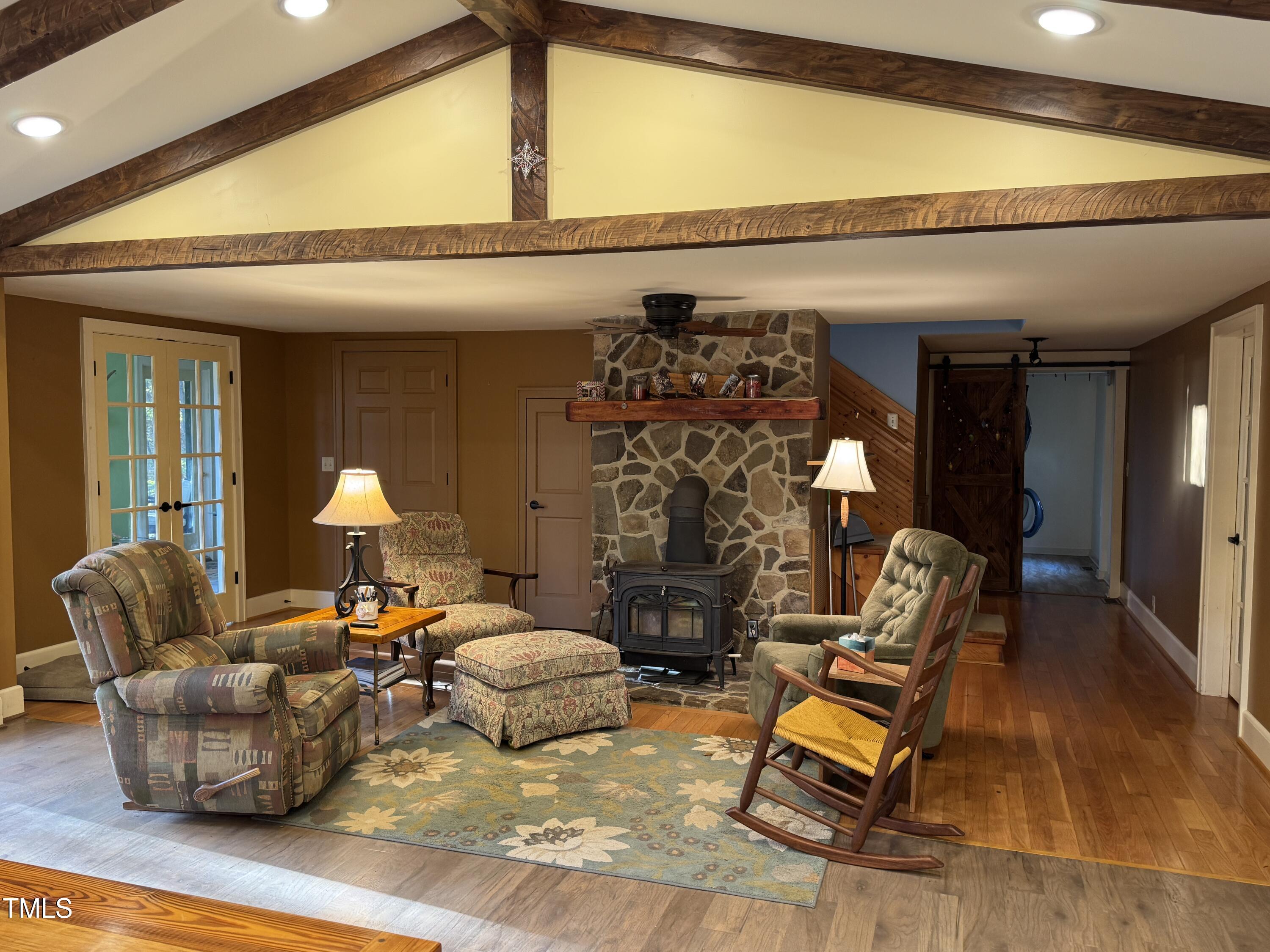 82 Woodspryte Hollow Road Timberlake, NC 27583 - Photo 4 of 29 a living room with furniture and a fireplace