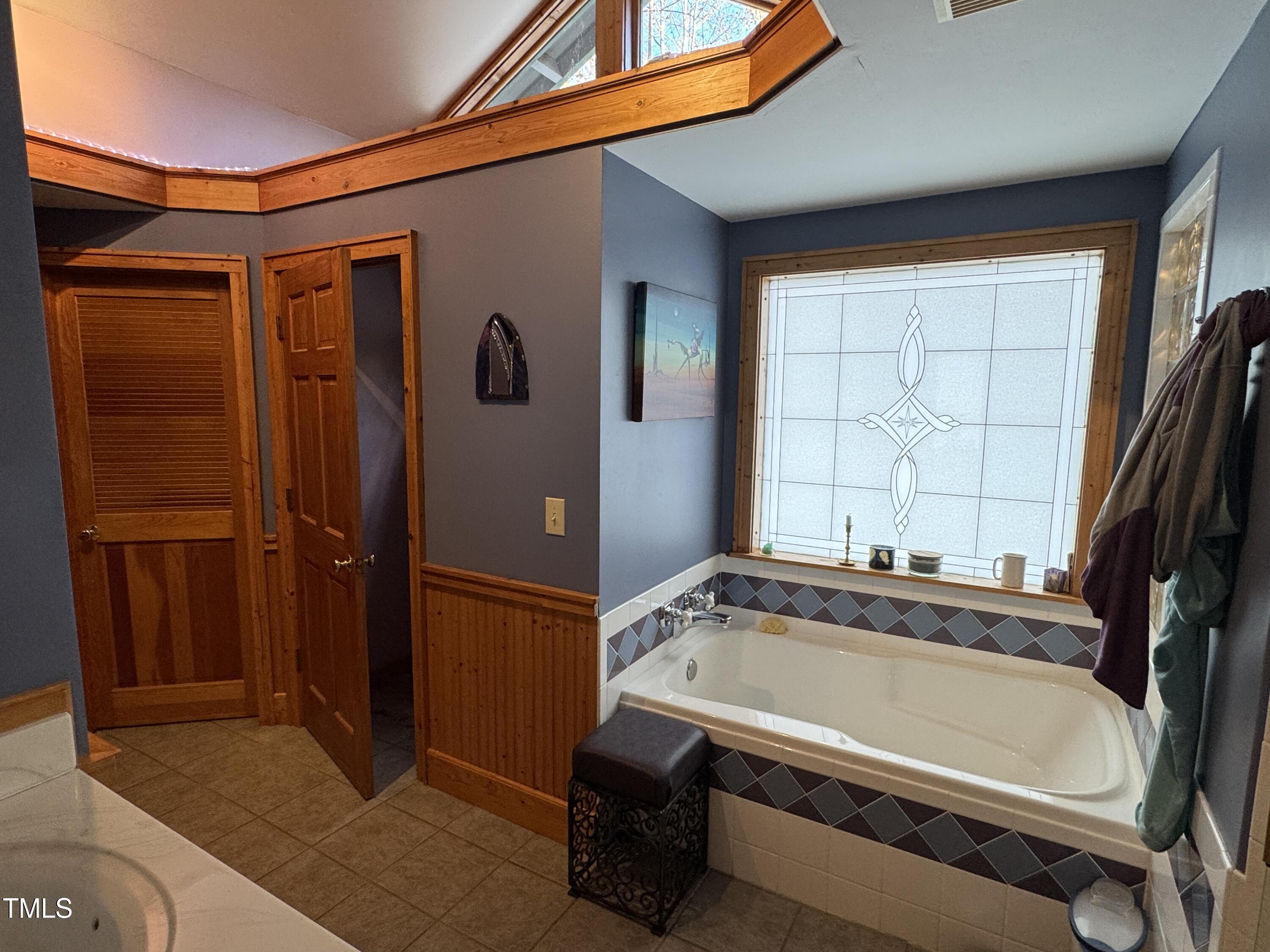82 Woodspryte Hollow Road Timberlake, NC 27583 - Photo 7 of 29 a bathroom with a tub and a shower