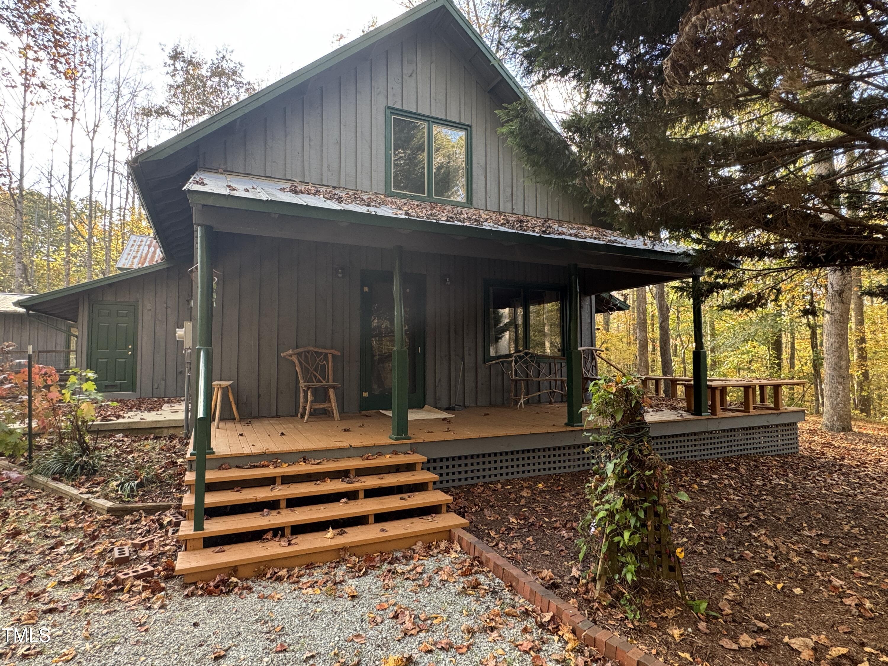 82 Woodspryte Hollow Road Timberlake, NC 27583 - Photo 10 of 29 a front view of a house with a garden