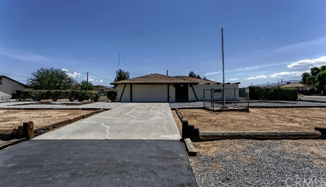 12557 Snapping Turtle Road Apple Valley, CA 92308 - Photo 1 of 1 a view of a swimming pool with a sitting space