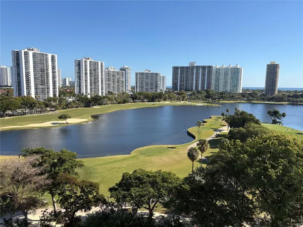 a view of a city with a lake