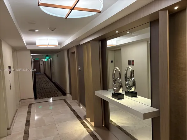 a living room with couches and a flat screen tv