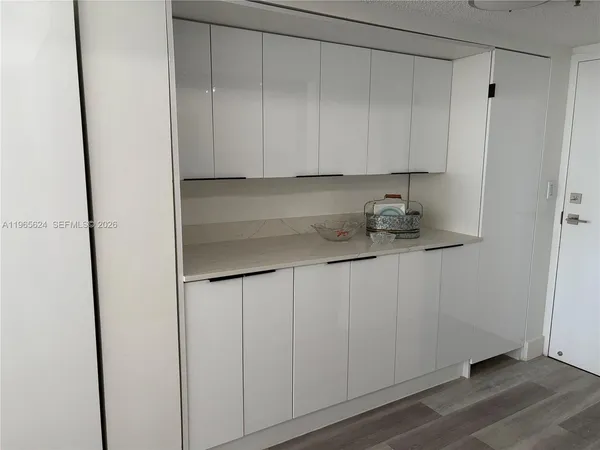 a kitchen with a sink and cabinets