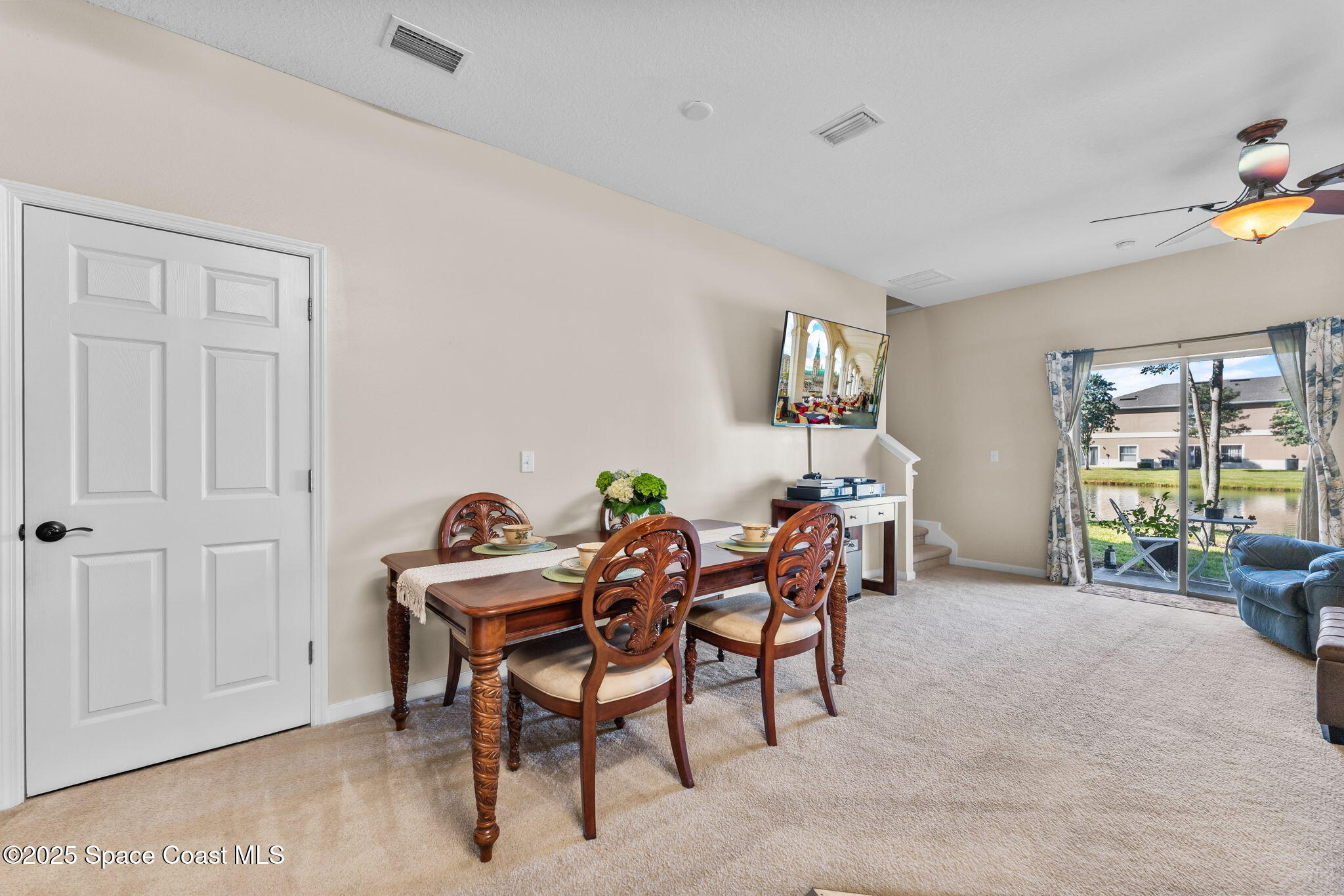 2690 Revolution Street, Unit 104 Melbourne, FL 32935 - Photo 13 of 35 a view of a dining room with furniture window and outside view