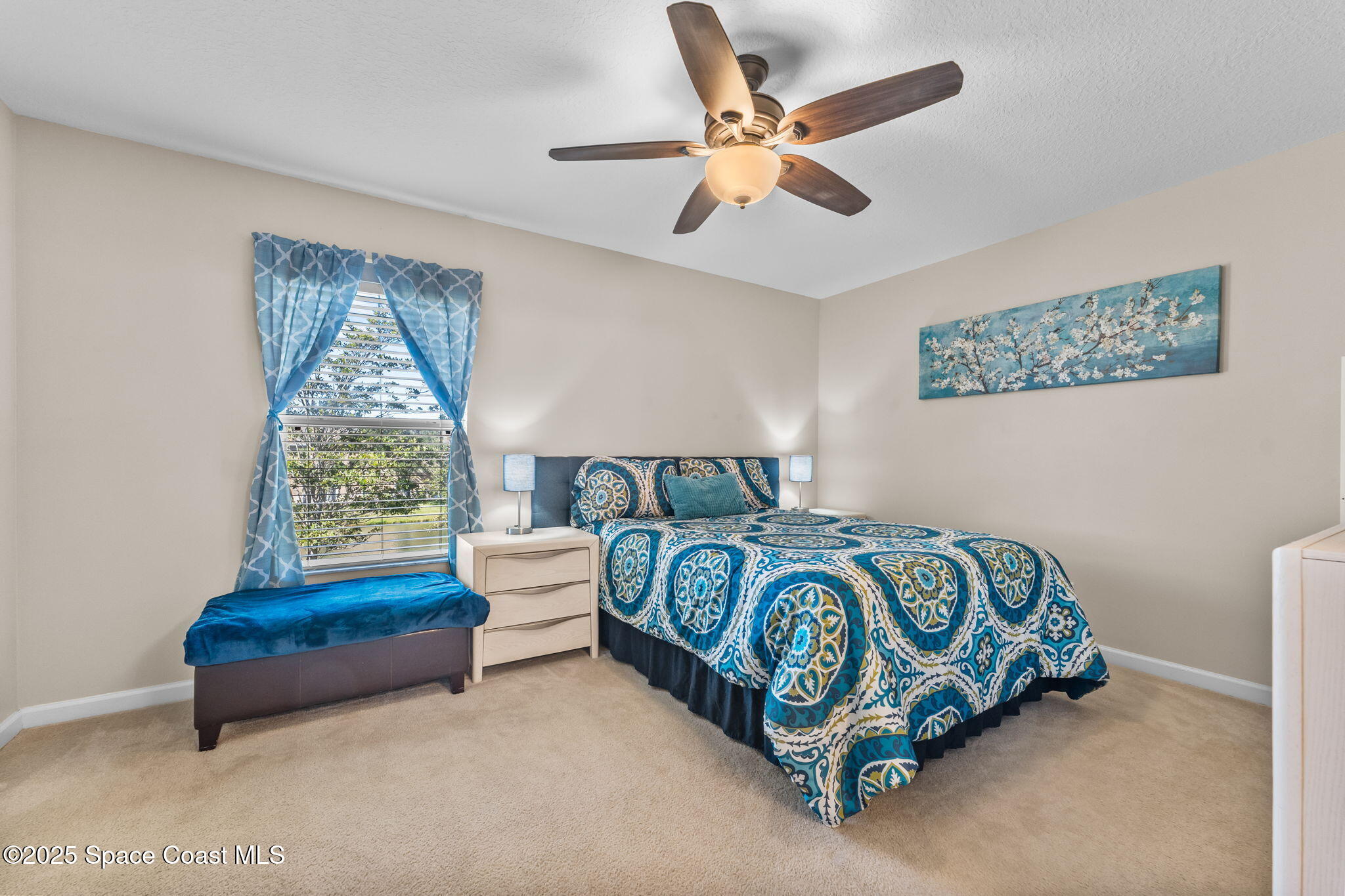 2690 Revolution Street, Unit 104 Melbourne, FL 32935 - Photo 16 of 35 a bedroom with a bed and a window