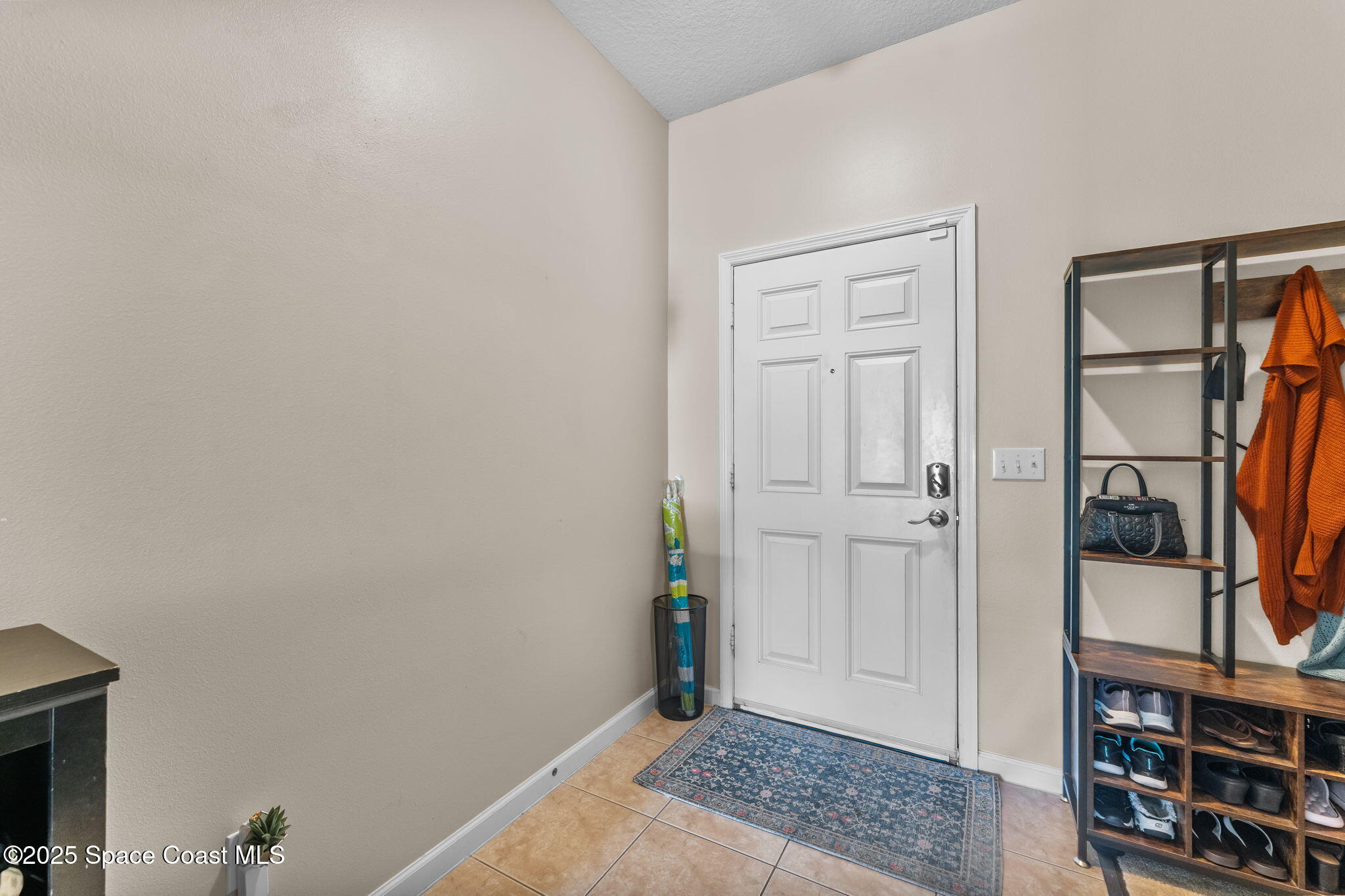 2690 Revolution Street, Unit 104 Melbourne, FL 32935 - Photo 2 of 35 a view of an entryway with wooden floor
