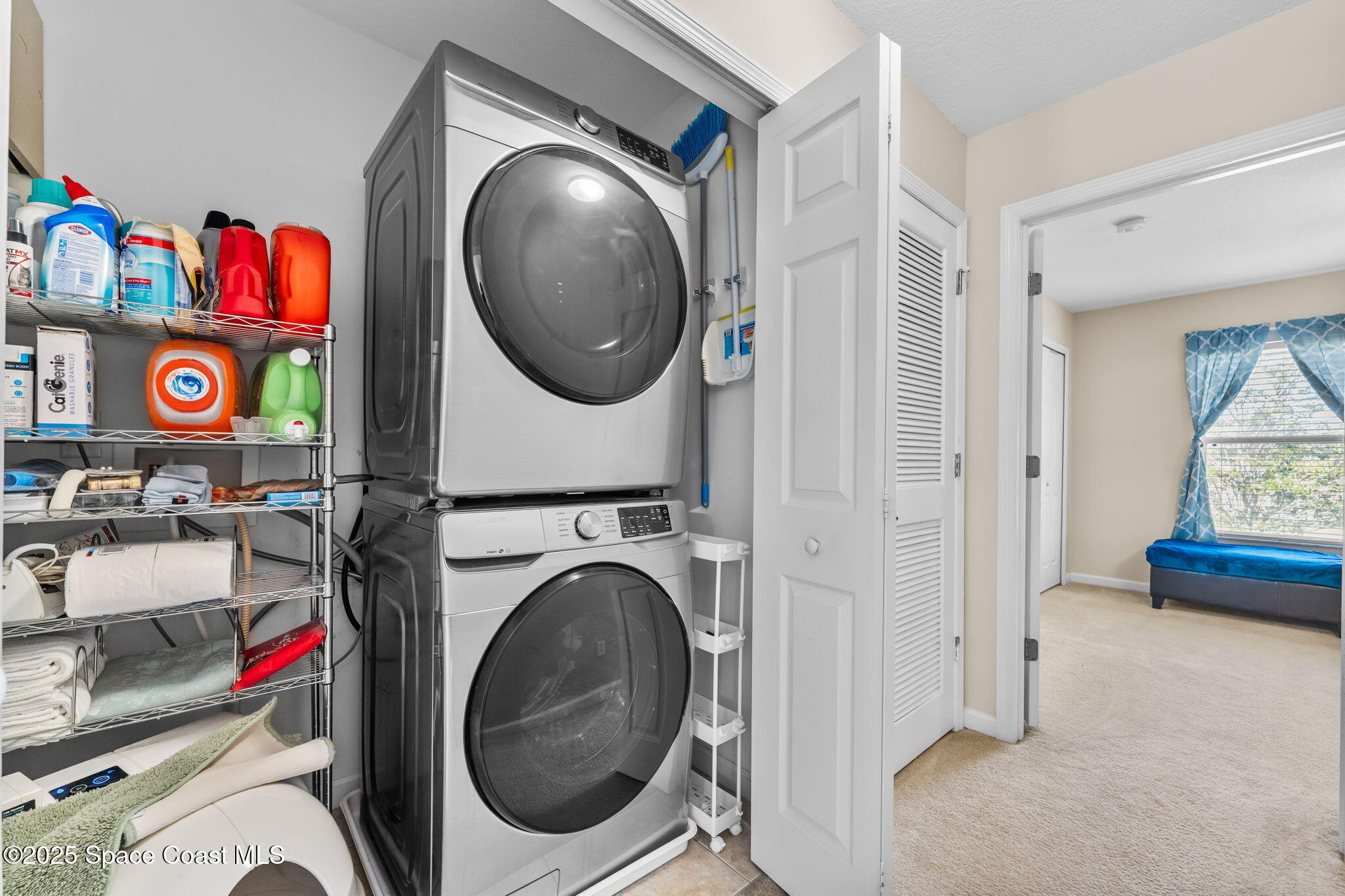 2690 Revolution Street, Unit 104 Melbourne, FL 32935 - Photo 21 of 35 a view of an entryway with washer and dryer