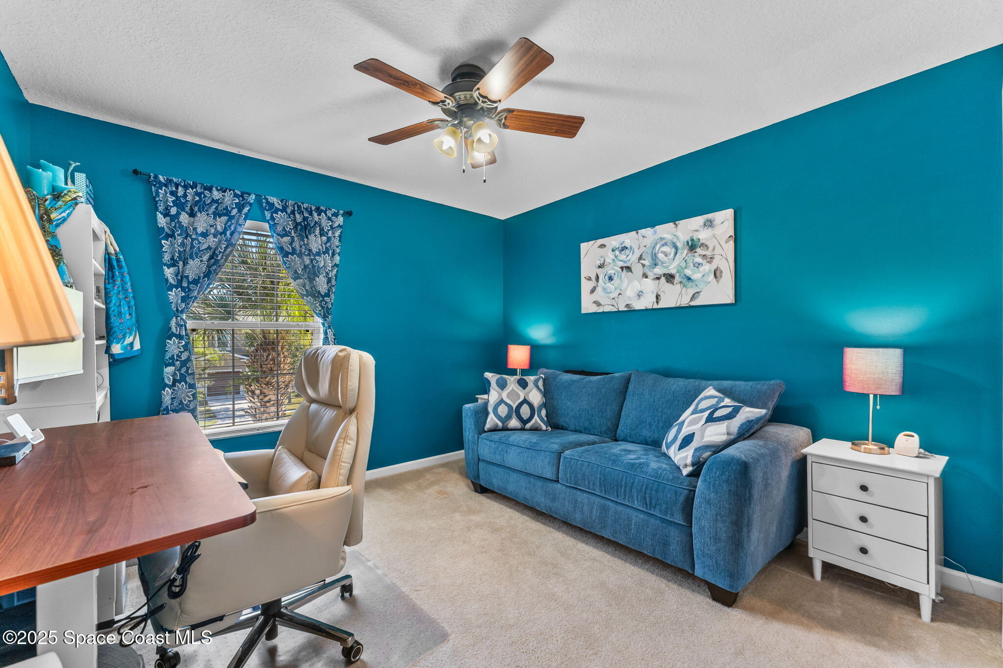 2690 Revolution Street, Unit 104 Melbourne, FL 32935 - Photo 23 of 35 a living room with furniture and a large window